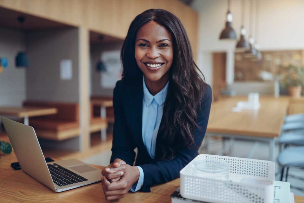 Smiling young African American businesswoman working in an office